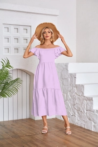 Detail of lavender midi dress with ruffle butterfly sleeves and tiered skirt on model
