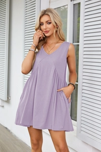 Close-up of a light purple V-neck sleeveless dress featuring a high waist and side pockets