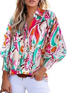 Detail view of abstract print blouse featuring elastic smocked cuffs and V-neckline