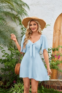 Detail of light blue mini dress with a bow tie V-neck and ruffled short sleeves