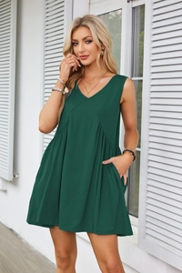 Close-up detail of forest green V-neck sleeveless dress featuring practical side pockets