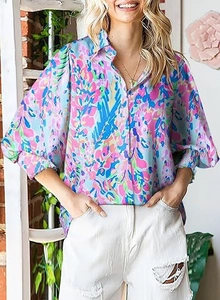 Close-up of floral print shirt featuring puff sleeves and elastic cuffs for women