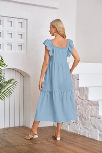 Detail of light blue tiered seersucker dress featuring flutter sleeves and ruffled hemline