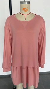 Pink long sleeve sweatshirt dress with cross-stitched crew neck and ruffled hem detail