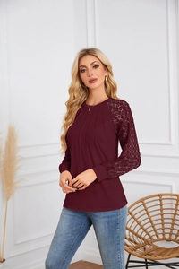 Detail of burgundy lace long sleeves and pleated round neck on a casual women top