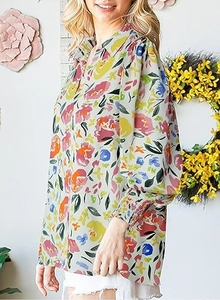 Detailed close-up of long lantern sleeves with colorful floral print on chiffon shirt