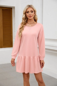 Detail view of light pink long sleeve sweatshirt dress with casual crewneck and v-stitch
