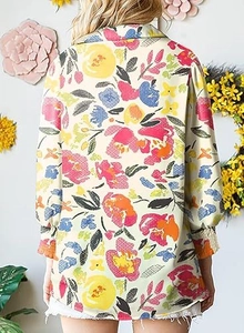 Rear view of a floral printed long sleeve shirt with lantern sleeves and abstract flower patterns