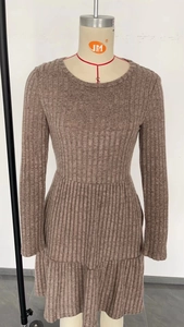 Detailed vertical ribbed texture and crew neck design on a slim fit knit dress