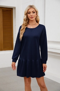 Detail of navy long-sleeve dress featuring a crew neck and elegant flounce hem design