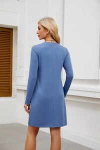Rear view of a blue long-sleeve knit midi dress featuring a sleek back center seam