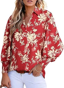 Detail of red floral blouse with lantern sleeves, elastic cuffs and a v-neckline