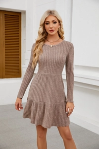Detail of the brown ribbed knit texture and ruffled hem on a long sleeve dress
