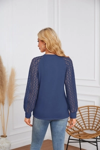 Back view of long sleeve top with navy knit fabric and geometric lace splicing details