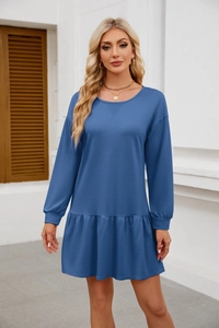 Close-up of royal blue long-sleeve tunic dress with tiered ruffle hem and crew neck details