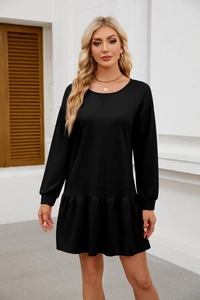 Detail of cross-stitched round neckline and ruffled hem on black long sleeve dress