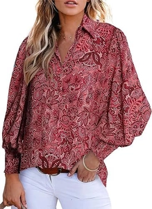 Detail of red floral paisley pattern on long lantern sleeves with wide cuffs