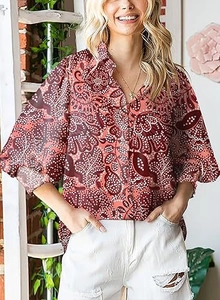 Close-up of retro abstract floral print on a long-sleeve blouse with V-neckline