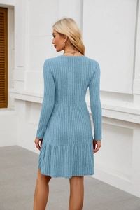 Detailed back view of a light blue long-sleeved tiered knit dress with ribbed texture