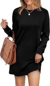 Detail of minimalist black crew neck long sleeve dress with subtle back pleated texture