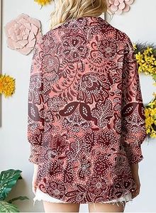 Back view of a long-sleeved paisley floral print blouse with bohemian aesthetic