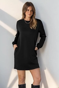 Detail view of black crewneck sweatshirt dress with functional side pockets and ribbed cuffs