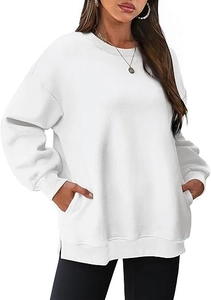 Detail of white oversized sweatshirt showing side pockets and ribbed crew neck design