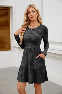 Detail of charcoal rib-knit texture and side pockets on a casual long-sleeved dress