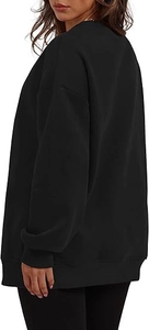 Back view of a black oversized crewneck sweatshirt featuring drop shoulders and ribbing
