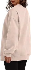 Side view of oversized apricot crewneck sweatshirt with dropped shoulders and ribbed cuffs