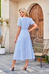 Detail view showing elastic high waist and three-tier layered cake skirt of the blue dress