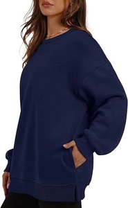 Detail of navy oversized sweatshirt with side slits and hidden side pockets for women