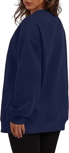 Side view of oversized navy blue crewneck sweatshirt with ribbed cuffs and hem
