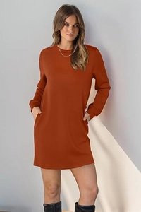 Detail of caramel knit dress featuring functional side pockets and soft crewneck texture
