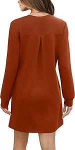 Detail view of rust red long sleeve sweatshirt dress with inverted pleat on the back
