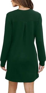 Detail view of dark green crewneck dress featuring stylish pleated back design and long sleeves