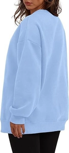 Detailed side-back view of light blue oversized sweatshirt with ribbed cuffs and hem
