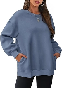 Detail view of oversized foggy blue crewneck sweatshirt with ribbed cuffs and side pockets