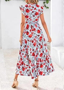 Detail view of the layered ruffle skirt and floral pattern on a blue midi summer dress