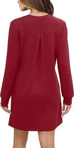 Detail of burgundy long sleeve dress featuring pleated back and ribbed cuffs