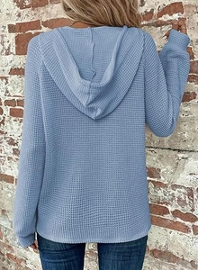 Detail shot of light blue waffle knit texture and hood design on back view hoodie