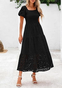 Close-up detail of black eyelet mesh dress with square neck and puffed sleeves