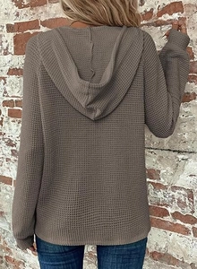 Rear view of brown waffle knit hoodie featuring drop shoulder and casual textured fabric
