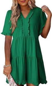 Detail of emerald green V-neck mini dress showing ruffled trims and tiered skirt layers