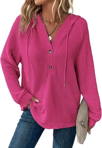 Detail of rose red waffle knit hoodie featuring V-neck buttons and adjustable drawstrings