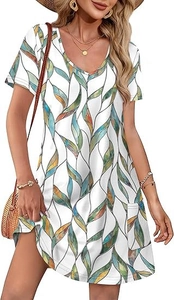 Detail of V-neck printed summer dress with abstract leaves and a functional side pocket