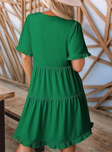 Detailed back view of a tiered emerald green summer dress with ruffled short sleeves and hem
