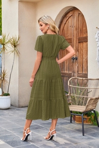 Detail view of army green tiered midi dress featuring textured fabric and elastic waist