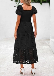 Detail view of black square neck dress featuring hollow embroidery and tiered puff sleeves