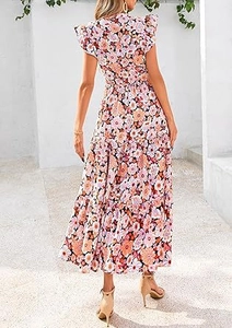 Rear view of floral tiered maxi dress featuring ruffle sleeves and colorful print pattern